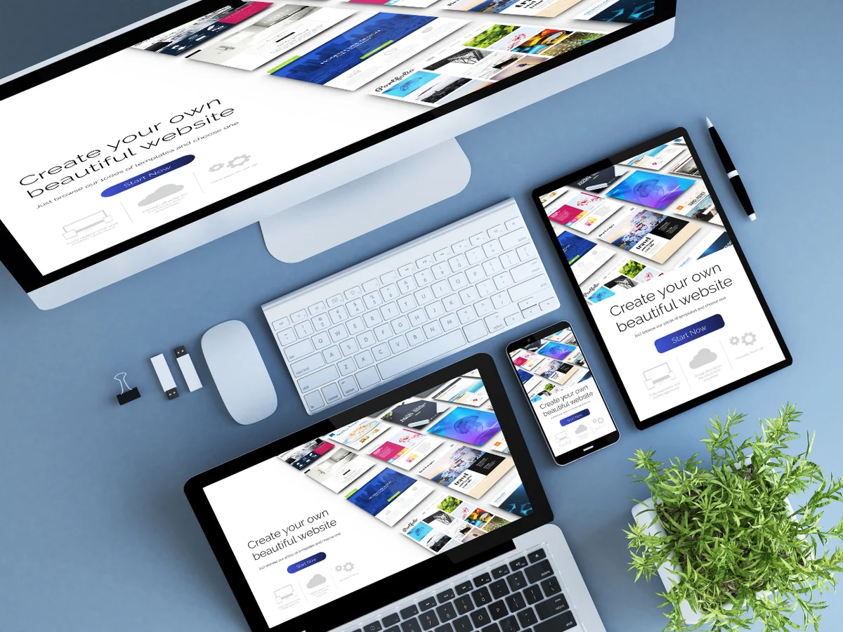A website design shown across desktop, laptop, tablet and phone